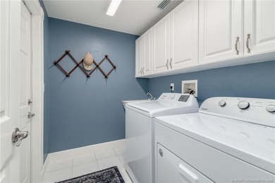 Ballantrae Pool Home with NEW ROOF, custom kitchen, new flooring on Santa Lucia River Club in Florida - for sale on GolfHomes.com, golf home, golf lot