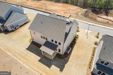 Welcome to the stunning Woodland model by Paran Homes, nestled on Traditions of Braselton Golf Club in Georgia - for sale on GolfHomes.com, golf home, golf lot
