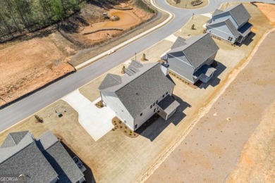Welcome to the stunning Woodland model by Paran Homes, nestled on Traditions of Braselton Golf Club in Georgia - for sale on GolfHomes.com, golf home, golf lot