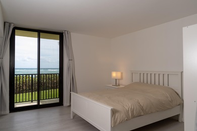 This spacious ocean end unit offers direct ocean views from its on Jupiter Dunes Golf Course in Florida - for sale on GolfHomes.com, golf home, golf lot