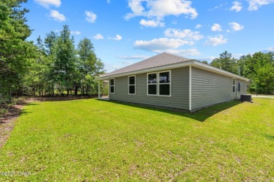 Tucked into a peaceful, wooded setting with no neighbors to the on Sunny Hills Golf and Country Club in Florida - for sale on GolfHomes.com, golf home, golf lot