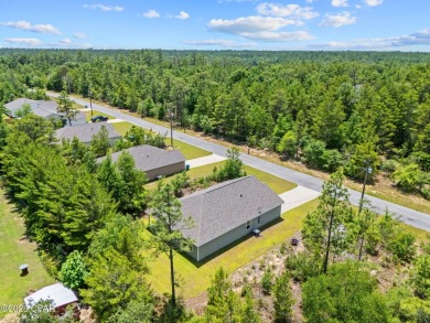 Tucked into a peaceful, wooded setting with no neighbors to the on Sunny Hills Golf and Country Club in Florida - for sale on GolfHomes.com, golf home, golf lot