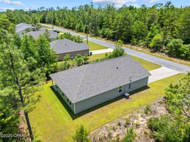 Tucked into a peaceful, wooded setting with no neighbors to the on Sunny Hills Golf and Country Club in Florida - for sale on GolfHomes.com, golf home, golf lot