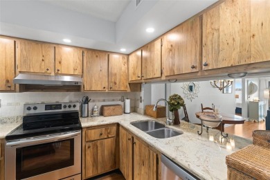Live the Florida dream in your new move-in ready corner unit on Isla Del Sol Yacht and Country Club in Florida - for sale on GolfHomes.com, golf home, golf lot