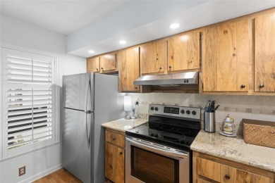 Live the Florida dream in your new move-in ready corner unit on Isla Del Sol Yacht and Country Club in Florida - for sale on GolfHomes.com, golf home, golf lot