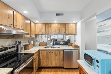 Live the Florida dream in your new move-in ready corner unit on Isla Del Sol Yacht and Country Club in Florida - for sale on GolfHomes.com, golf home, golf lot