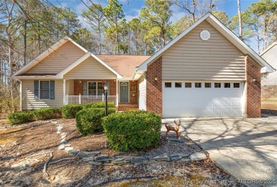 Welcome Home to this adorable home with a sweet cottage vibe on Carolina Trace Country Club in North Carolina - for sale on GolfHomes.com, golf home, golf lot