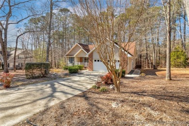 Welcome Home to this adorable home with a sweet cottage vibe on Carolina Trace Country Club in North Carolina - for sale on GolfHomes.com, golf home, golf lot