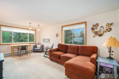 Set against the backdrop of Estes Park's natural beauty, this on Estes Park Golf Course in Colorado - for sale on GolfHomes.com, golf home, golf lot