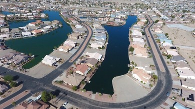 This home is located in the prestigious gated community of Los on Los Lagos Golf Club in Arizona - for sale on GolfHomes.com, golf home, golf lot