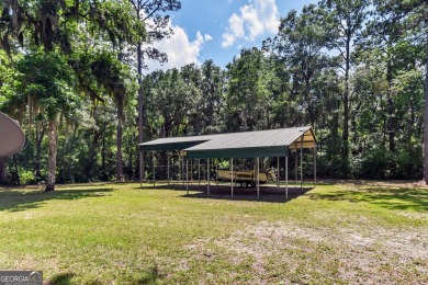 Nestled in the heart of Shellman Bluff, this two bedroom/two on Sapelo Hammock Golf Club in Georgia - for sale on GolfHomes.com, golf home, golf lot