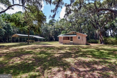 Nestled in the heart of Shellman Bluff, this two bedroom/two on Sapelo Hammock Golf Club in Georgia - for sale on GolfHomes.com, golf home, golf lot