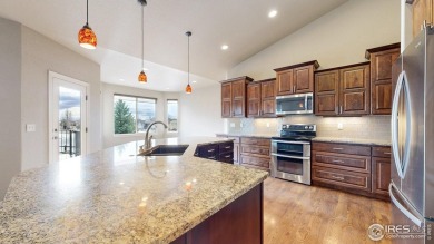 Experience the best of both worlds: watch golfers tee off across on Highland Meadows Golf Course in Colorado - for sale on GolfHomes.com, golf home, golf lot