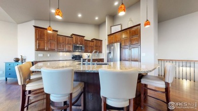 Experience the best of both worlds: watch golfers tee off across on Highland Meadows Golf Course in Colorado - for sale on GolfHomes.com, golf home, golf lot
