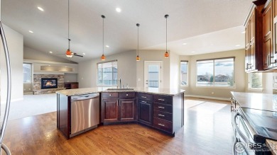 Experience the best of both worlds: watch golfers tee off across on Highland Meadows Golf Course in Colorado - for sale on GolfHomes.com, golf home, golf lot