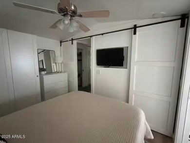 Nestled in a charming RV resort community in Mesa, this 1-bed on Apache Wells Country Club in Arizona - for sale on GolfHomes.com, golf home, golf lot