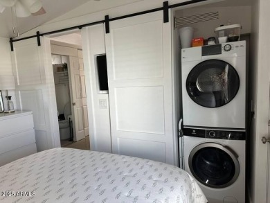 Nestled in a charming RV resort community in Mesa, this 1-bed on Apache Wells Country Club in Arizona - for sale on GolfHomes.com, golf home, golf lot