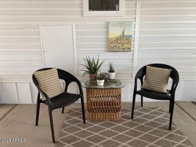Nestled in a charming RV resort community in Mesa, this 1-bed on Apache Wells Country Club in Arizona - for sale on GolfHomes.com, golf home, golf lot