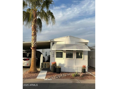 Nestled in a charming RV resort community in Mesa, this 1-bed on Apache Wells Country Club in Arizona - for sale on GolfHomes.com, golf home, golf lot