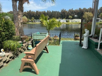 LAKE HOME...GOLF CART INCLUDED ... 55+ Community ...pets allowed on Vista Plantation Golf Club in Florida - for sale on GolfHomes.com, golf home, golf lot