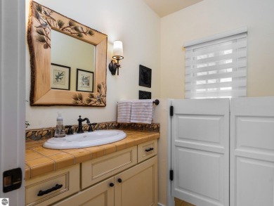 Welcome to this stunning 5-bedroom, 5.5-bath estate on Crystal Mountain Golf Course in Michigan - for sale on GolfHomes.com, golf home, golf lot