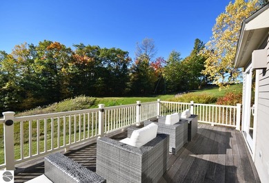Welcome to this stunning home! Chimney Ridge 8 is situated along on Mountain Flowers Golf Course in Michigan - for sale on GolfHomes.com, golf home, golf lot