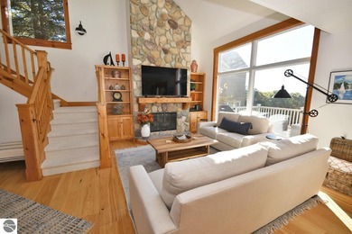 Welcome to this stunning home! Chimney Ridge 8 is situated along on Mountain Flowers Golf Course in Michigan - for sale on GolfHomes.com, golf home, golf lot