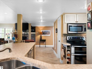 Welcome to this stunning 5-bedroom, 5.5-bath estate on Crystal Mountain Golf Course in Michigan - for sale on GolfHomes.com, golf home, golf lot