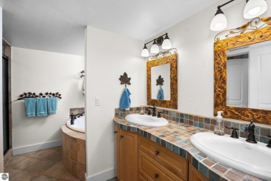 Welcome to this stunning 5-bedroom, 5.5-bath estate on Crystal Mountain Golf Course in Michigan - for sale on GolfHomes.com, golf home, golf lot