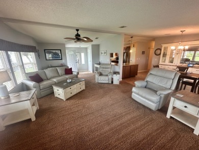 This beautiful Palm Harbour stucco home is located on the golf on Del Tura Golf and Country Club in Florida - for sale on GolfHomes.com, golf home, golf lot