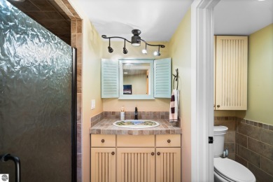 Welcome to this stunning 5-bedroom, 5.5-bath estate on Crystal Mountain Golf Course in Michigan - for sale on GolfHomes.com, golf home, golf lot