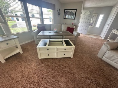 This beautiful Palm Harbour stucco home is located on the golf on Del Tura Golf and Country Club in Florida - for sale on GolfHomes.com, golf home, golf lot