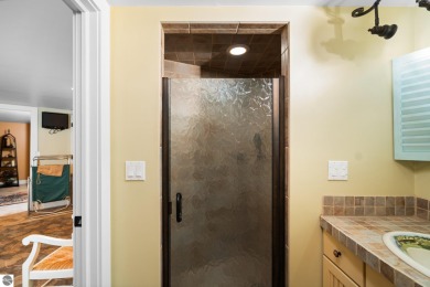 Welcome to this stunning 5-bedroom, 5.5-bath estate on Crystal Mountain Golf Course in Michigan - for sale on GolfHomes.com, golf home, golf lot