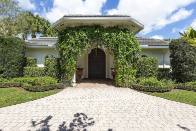 This beautiful courtyard home features four bedrooms on Palm Beach Polo and Country Club in Florida - for sale on GolfHomes.com, golf home, golf lot