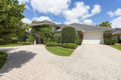 This beautiful courtyard home features four bedrooms on Palm Beach Polo and Country Club in Florida - for sale on GolfHomes.com, golf home, golf lot