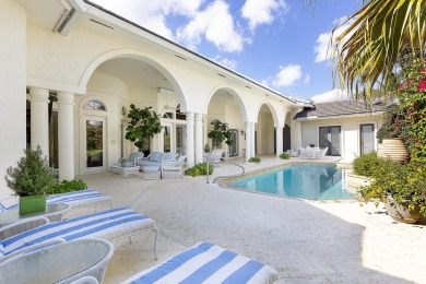 This beautiful courtyard home features four bedrooms on Palm Beach Polo and Country Club in Florida - for sale on GolfHomes.com, golf home, golf lot