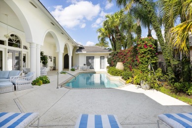 This beautiful courtyard home features four bedrooms on Palm Beach Polo and Country Club in Florida - for sale on GolfHomes.com, golf home, golf lot