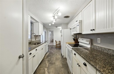 Experience Florida living at its finest in this beautifully on Jacaranda West Country Club in Florida - for sale on GolfHomes.com, golf home, golf lot