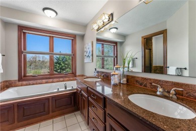 Tucked within the prestigious and serene Lake Riley Woods on Halla Green Executive Golf Course in Minnesota - for sale on GolfHomes.com, golf home, golf lot