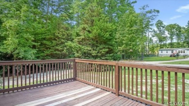 Fully furnished and move-in ready! This beautifully remodeled on Tanglewood Shores Golf Club in Virginia - for sale on GolfHomes.com, golf home, golf lot