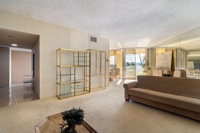 Perched above the shimmering lake and emerald fairways, 899 on Desert Island Golf and Country Club in California - for sale on GolfHomes.com, golf home, golf lot