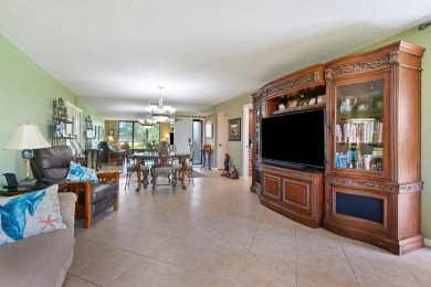 This stunning first-floor 2-bd, 2-ba condo offers a lifestyle of on BallenIsles Golf and Country Club in Florida - for sale on GolfHomes.com, golf home, golf lot