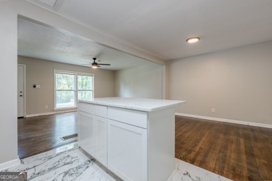 This home qualifies for up to $15,000 in grants-no income limits on Browns Mill Golf Course in Georgia - for sale on GolfHomes.com, golf home, golf lot
