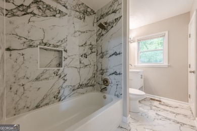 This home qualifies for up to $15,000 in grants-no income limits on Browns Mill Golf Course in Georgia - for sale on GolfHomes.com, golf home, golf lot