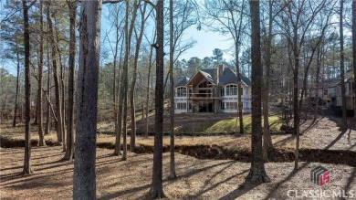 Introducing a New Construction luxurious custom home nestled in on Reynolds Lake Oconee - The Oconee in Georgia - for sale on GolfHomes.com, golf home, golf lot