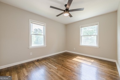 This home qualifies for up to $15,000 in grants-no income limits on Browns Mill Golf Course in Georgia - for sale on GolfHomes.com, golf home, golf lot