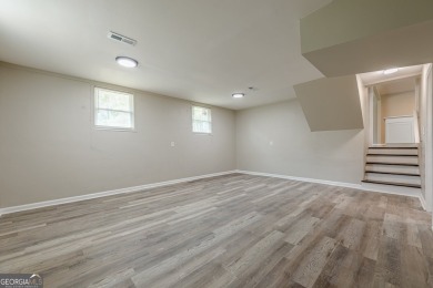This home qualifies for up to $15,000 in grants-no income limits on Browns Mill Golf Course in Georgia - for sale on GolfHomes.com, golf home, golf lot