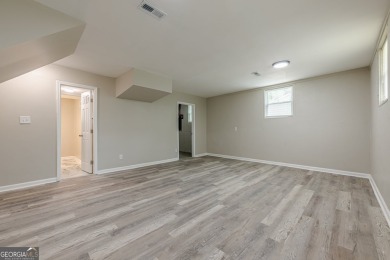 This home qualifies for up to $15,000 in grants-no income limits on Browns Mill Golf Course in Georgia - for sale on GolfHomes.com, golf home, golf lot