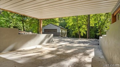 Completely remodeled inside and out, this 3-bedroom, 3-bath home on Tanglewood Shores Golf Club in Virginia - for sale on GolfHomes.com, golf home, golf lot