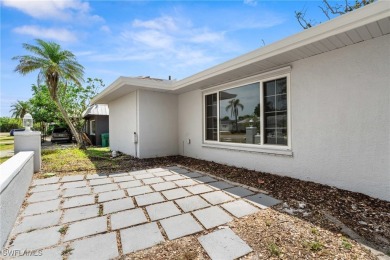 This stunning Renovated home IS STURDY AS STEEL AND NOTHING TO on Port Charlotte Golf Club in Florida - for sale on GolfHomes.com, golf home, golf lot